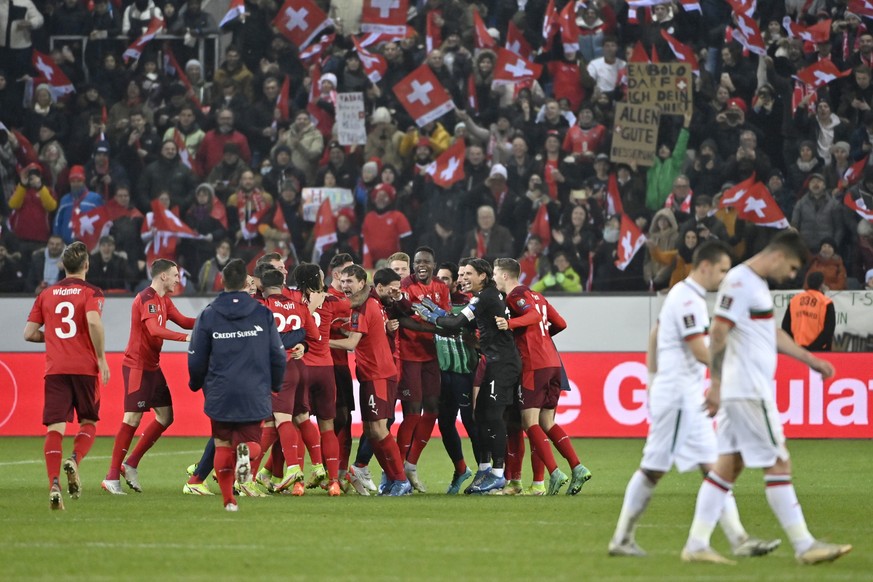 Switzerland&#039;s players celebrate after directly qualifying for the FIFA World Cup Qatar 2022 after the 2022 FIFA World Cup European Qualifying Group C match between Switzerland and Bulgaria at the ...