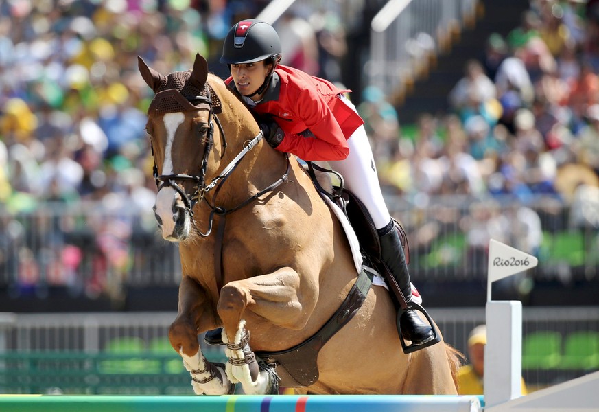 2016 Rio Olympics - Equestrian - Preliminary - Jumping Individual Qualification - Olympic Equestrian Centre - Rio de Janeiro, Brazil - 16/08/2016. Janika Sprunger (SUI) of Switzerland riding Bonne Cha ...