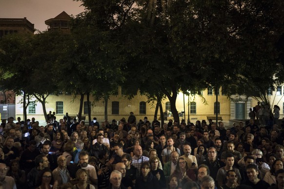 Pro-referendum supporters gather at the Escola Industrial, a school listed to be a polling station by the Catalan government, in Barcelona, Spain, Sunday, Oct. 1, 2017. Catalan pro-referendum supporte ...