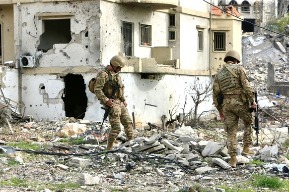epa11772481 Lebanese soldiers secure the area after Israeli troops withdrew from the Khiam village in the Marjayoun district, Nabatieh Governorate,southern Lebanon, 12 December 2024. The Israel army o ...