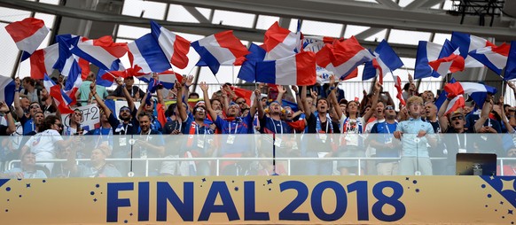epa06890338 Supporters of France cheer prior to the FIFA World Cup 2018 final between France and Croatia in Moscow, Russia, 15 July 2018.

(RESTRICTIONS APPLY: Editorial Use Only, not used in associ ...