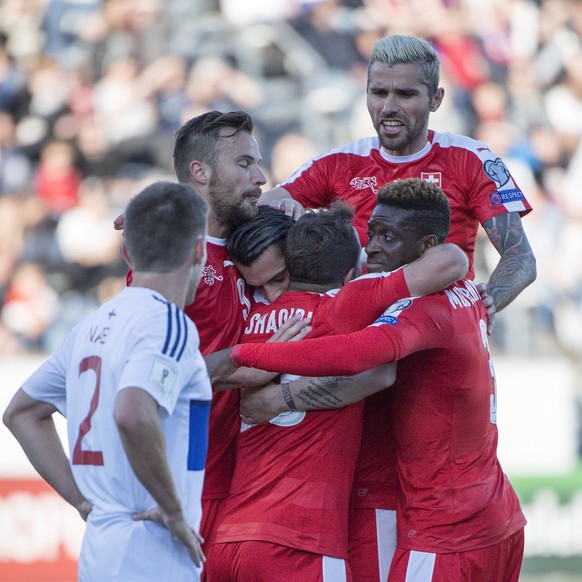 Switzerland&#039;s players cheer after scoring during the 2018 Fifa World Cup Russia group B qualification soccer match between Switzerland and Faroe Islands at the Torsvollur football stadium in Tors ...