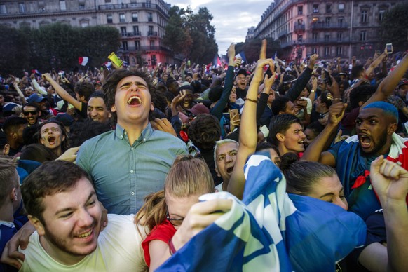 epa06879178 French fans at a public viewing in the Paris city hall square celebrate their team&#039;s victory in the FIFA 2018 World Cup semi final match between France and Belgium in Paris, France, 1 ...