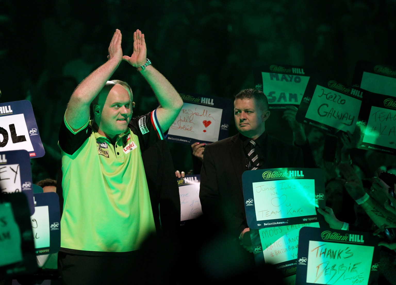 epa07257547 Dutch Michael van Gerwen (L) attends a match against British Michael Smith during the PDC World Championship final match at the Alexander Palace in North London, Britain, 01 January 2019.  ...