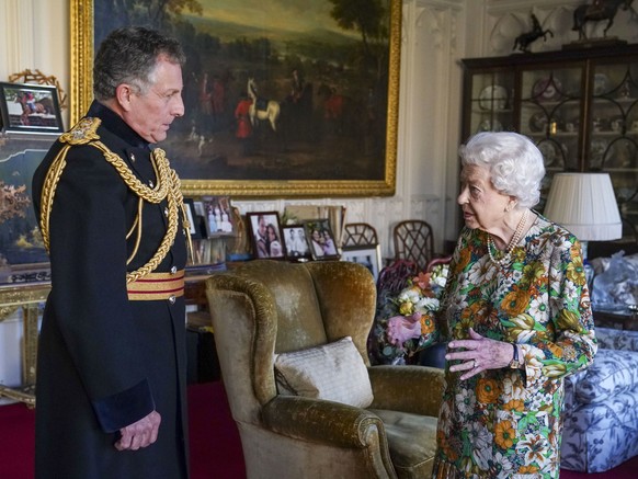 Queen Elizabeth II receives General Sir Nick Carter, Chief of the Defense Staff, left, during an audience in the Oak Room at Windsor Castle, Berkshire, Wednesday Nov. 17, 2021. General Sir Nick is rel ...