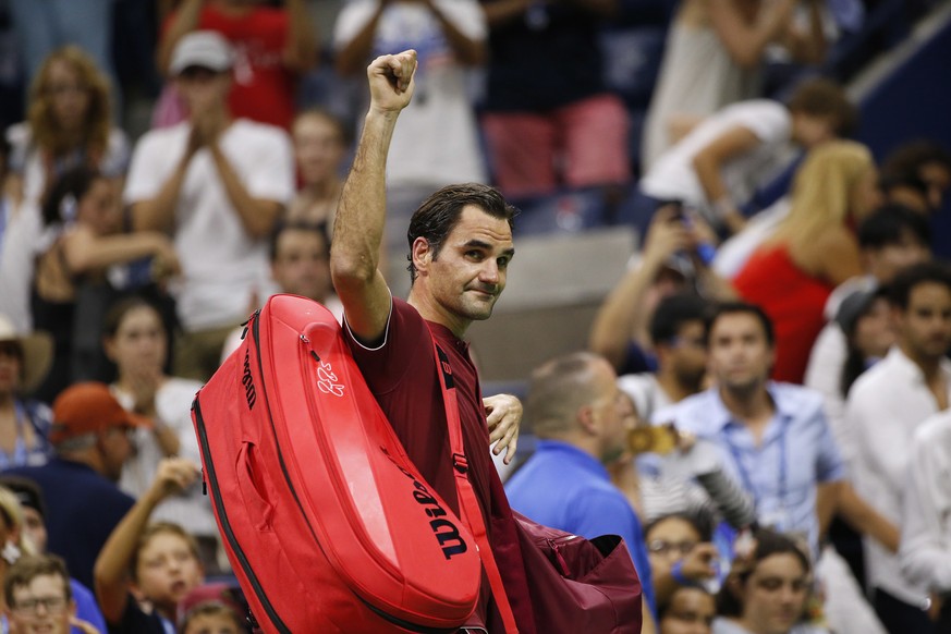 Roger Federer, of Switzerland, waves to the crowd as he leaves the court after losing to John Millman, of Australia, during the fourth round of the U.S. Open tennis tournament early Tuesday, Sept. 4,  ...