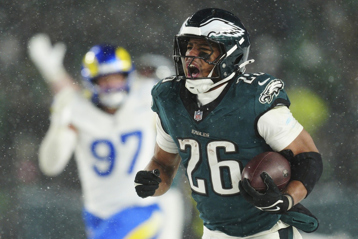 FILE - Philadelphia Eagles running back Saquon Barkley (26) runs the ball for a touchdown during the second half of an NFL football NFC divisional playoff game against the Los Angeles Rams on Sunday,  ...