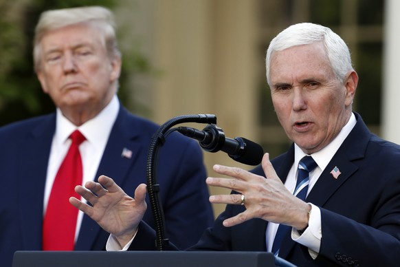 FILE - President Donald Trump listens as Vice President Mike Pence speaks about the coronavirus in the Rose Garden of the White House, April 27, 2020, in Washington. As Mike Pence approaches a likely  ...