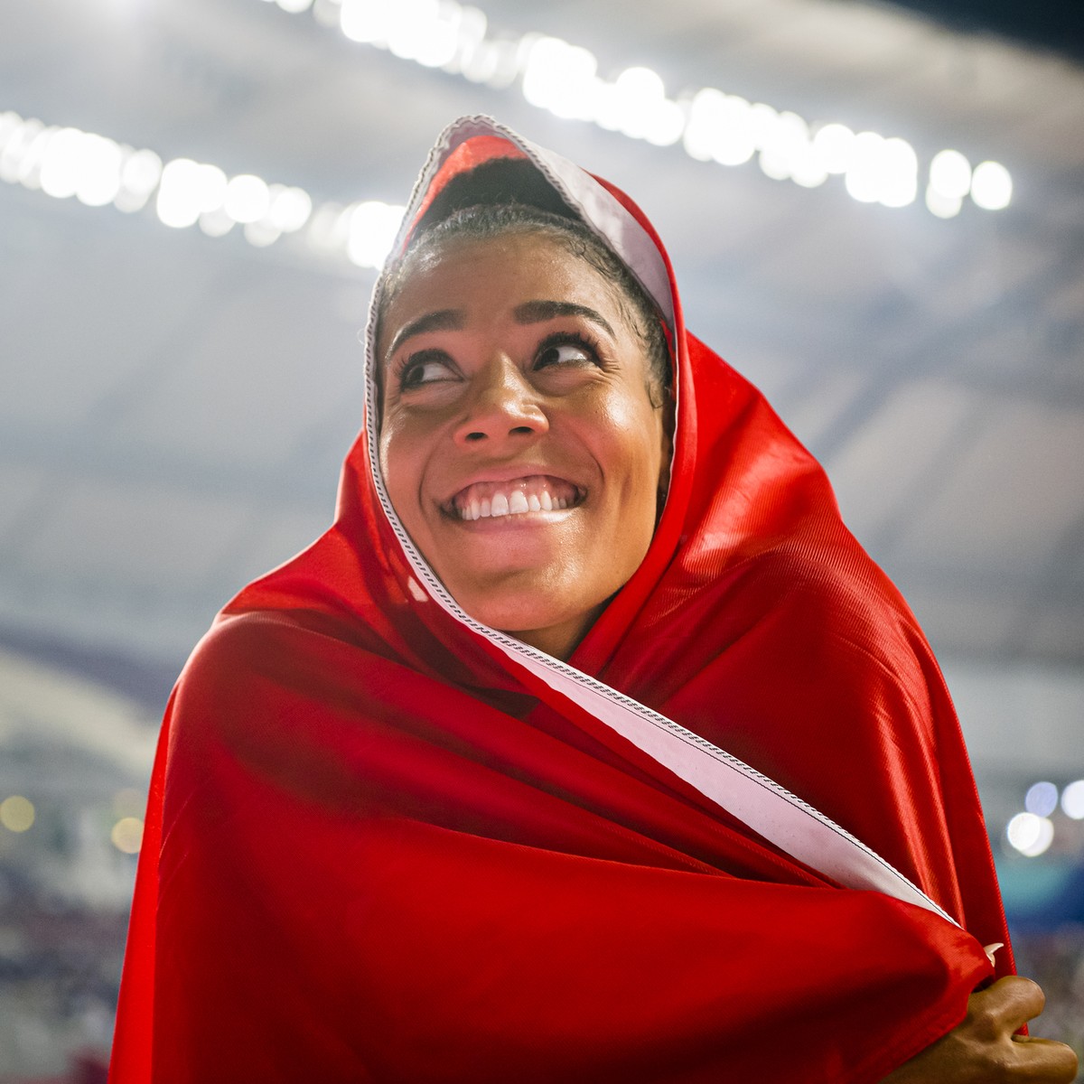 ARCHIV - ZUM JAHRESRUECKBLICK 2019 - SPORT STELLEN WIR IHNEN FOLGENDES BILDMATERIAL ZUR VERFUEGUNG - Bronze medal Mujinga Kambundji from Switzerland celebrates during the women's 200 meters final ...
