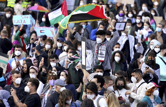 People attend a protest rally in solidarity with Palestinians in Berlin, Germany, Saturday, May 15, 2021. (AP Photo/Michael Sohn)