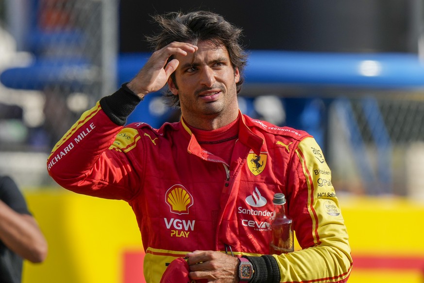 Ferrari driver Carlos Sainz of Spain celebrates his pole position after the qualifying session ahead of Sunday&#039;s Formula One Italian Grand Prix auto race, at the Monza racetrack, in Monza, Italy, ...