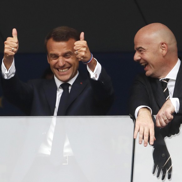 French President Emannuel Macron, left, and FIFA President Gianni Infantino in the stands prior to during the final match between France and Croatia at the 2018 soccer World Cup in the Luzhniki Stadiu ...