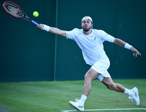 epa06066364 Paolo Lorenzi of Italy in action against Horacio Zeballos of Argentina during their first round match for the Wimbledon Championships at the All England Lawn Tennis Club, in London, Britai ...