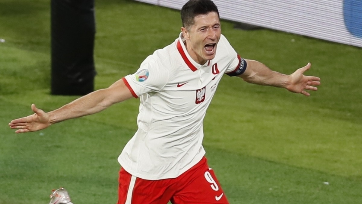 Poland's Robert Lewandowski celebrates after scoring his side's opening goal during the Euro 2020 soccer championship group E match between Spain and Poland at Estadio de la Cartuja stadium  ...