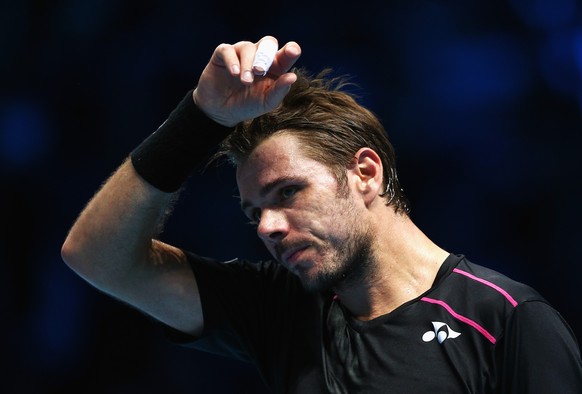 LONDON, ENGLAND - NOVEMBER 16: Stanislas Wawrinka of Switzerland wipes his brow in his men&#039;s singles match against Rafael Nadal of Spain during day two of the Barclays ATP World Tour Finals at O2 ...