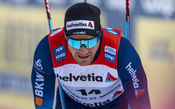 epa09073497 Dario Cologna of Switzerland after the men&#039;s 50 km Cross-Country Skiing World Cup race in S-Chanf, Switzerland, 14 March 2021. EPA/GIAN EHRENZELLER