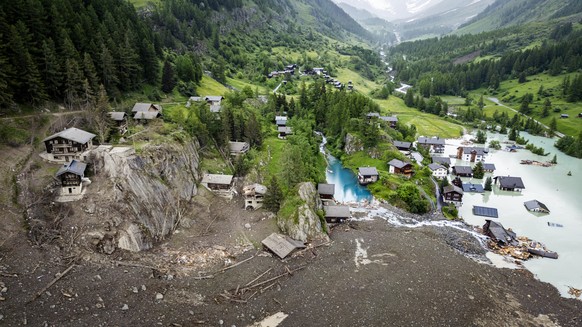 epaselect epa12160084 An aerial view shows houses devastated by the force of a massive avalanche triggered by the collapse of the Birch Glacier, which swept down to the valley floor and destroyed the  ...