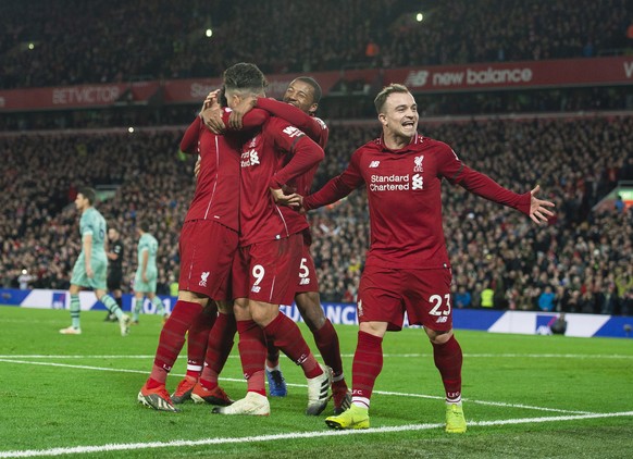 epa07253385 Liverpool&#039;s Roberto Firmino celebrates scoring the sixth goal making the score 5-1 during the English Premier League soccer match between Liverpool and Arsenal at the Anfield in Liver ...