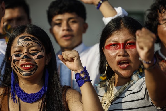 epa12515242 Indigenous women react onboard the Yaku Mama Amazon Flotilla after its arrival in the port city of Belem, Brazil, 09 November 2025. The flotilla is an Indigenous-led expedition that travel ...