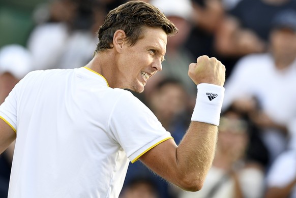 epa06079803 Tomas Berdych of the Czech Republic celebrates winning against Dominic Thiem of Austria during their fourth round match for the Wimbledon Championships at the All England Lawn Tennis Club, ...