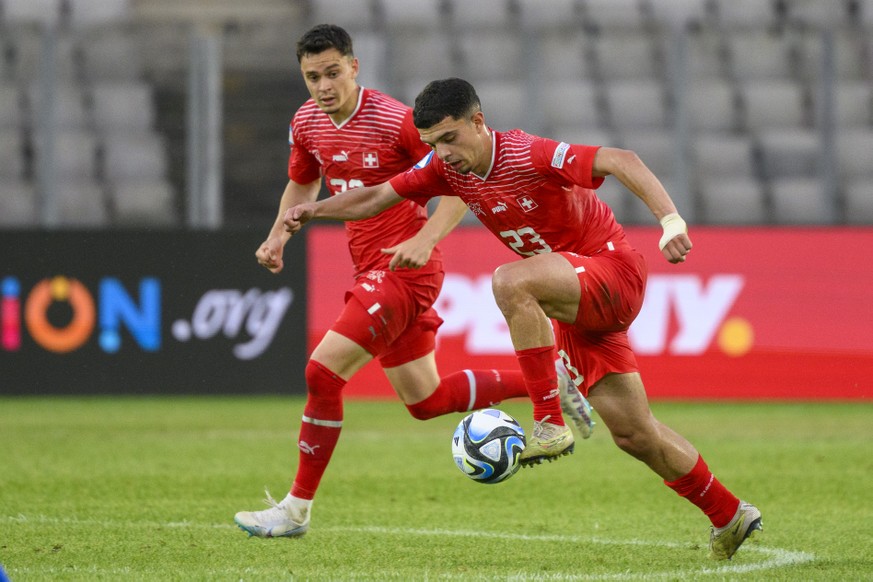 Switzerland&#039;s Zeki Amdouni, front, and Fabian Rieder, back, during a Group D match between Switzerland and Italy at the 2023 UEFA European Under-21 Championship final tournament in the Cluj Arena ...