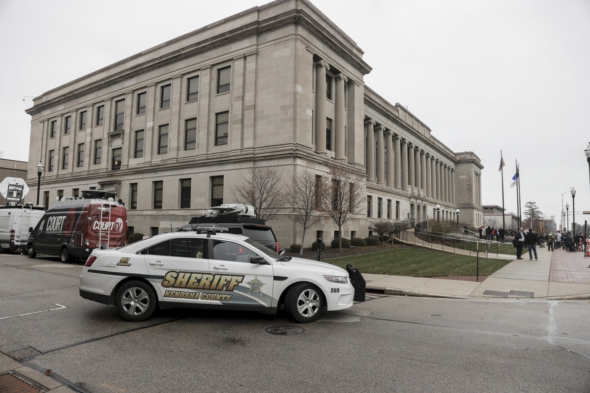 epa09587685 A sheriff deputy sits in his car outside the Kenosha County courthouse as the jury deliberates for a second day in the trial of Kyle Rittenhouse take place in Kenosha, Wisconsin, USA, 17 N ...
