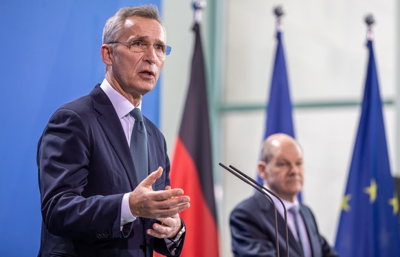 epa09693175 German Chancellor Olaf Scholz (R) and NATO Secretary General Jens Stoltenberg (L) at a press briefing after a meeting at the Federal Chancellery in Berlin, Germany, 18 January 2022. EPA/AN ...