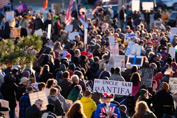 Protesters gather during a rally for Renee Good, who was fatally shot by an ICE officer in Minneapolis, Saturday, Jan. 10, 2026, in Kansas City, Mo. (AP Photo/Charlie Riedel)
Immigration Enforcement P ...