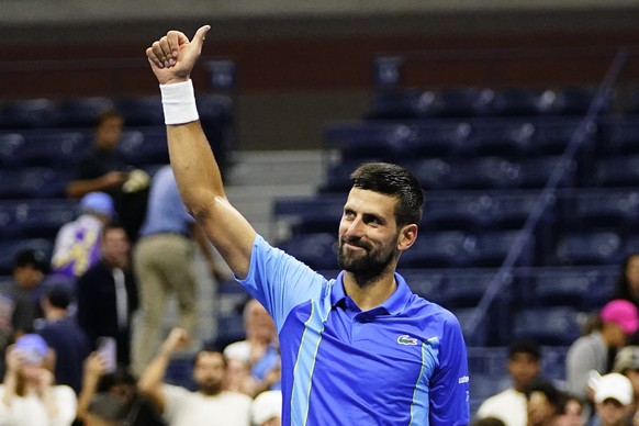 Novak Djokovic, of Serbia, celebrates winning his match against Alexandre Muller, of France, during the first round of the U.S. Open tennis championships, Tuesday, Aug. 29, 2023, in New York. (AP Phot ...