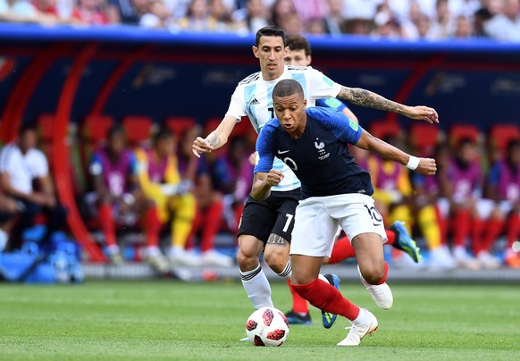 Soccer: World Cup-France vs Argentina, Jun 30, 2018 Kazan, Russia France forward Kylian Mbappe 10 controls the ball in front of Argentina midfielder Angel Di Maria 11 in the round of 16 during the FIF ...