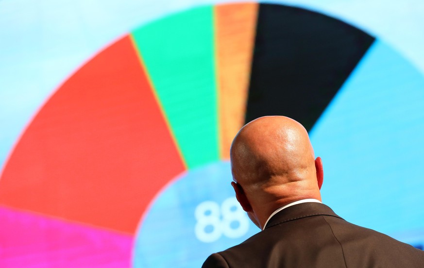 epa08424398 epa07810678 (FILE) Brandenburg chairman and top candidate of the Alternative for Germany (AfD) right-wing populist party Andreas Kalbitz looks at a display showing a graphic of possible de ...