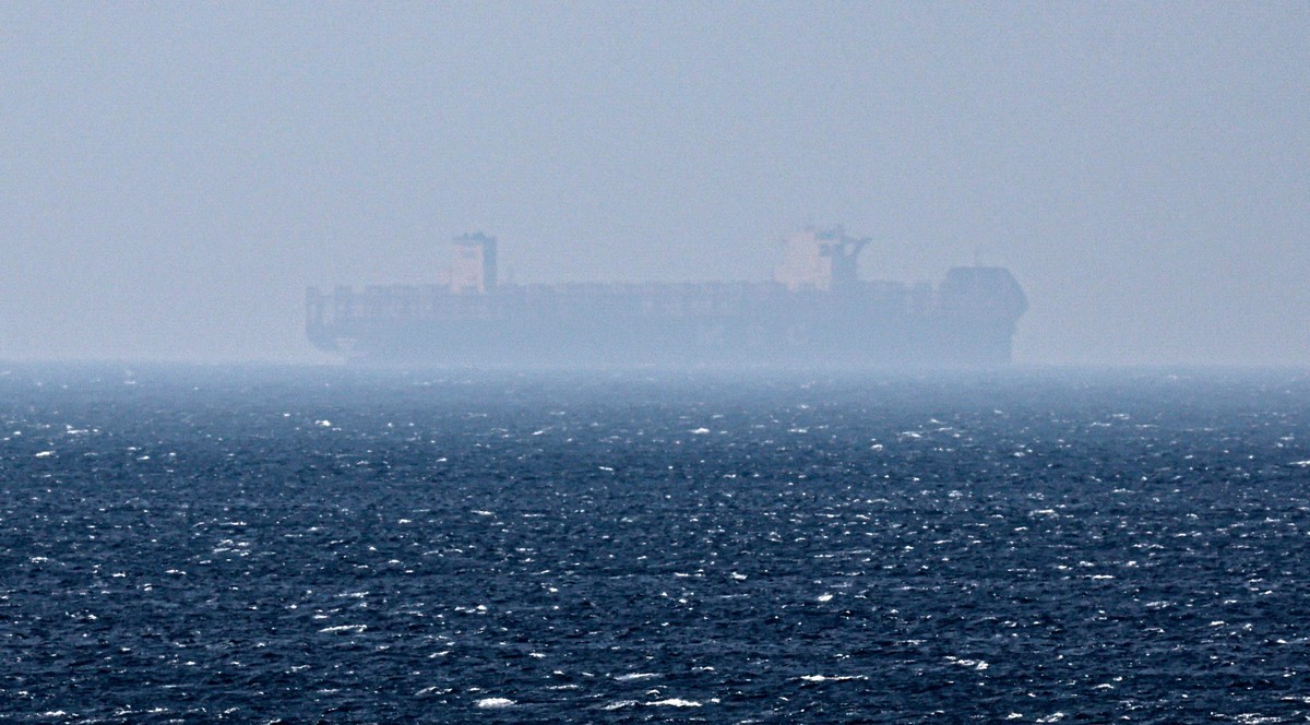 epa12194518 A ship sails in the Strait of Hormuz as seen from Khasab, Musandam Governorate, Oman, 24 June 2025. The Iranian parliament approved a measure to close the Strait of Hormuz following US str ...