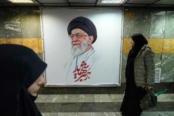 People walk past a portrait of the late Iranian Supreme Leader Ayatollah Ali Khamenei in a corridor of a subway station in Tehran, Iran, Friday, March 13, 2026. (AP Photo/Vahid Salemi)
Iran US Israel
