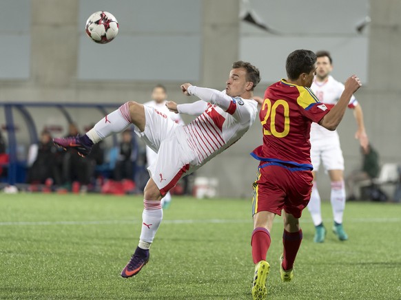 Switzerland&#039;s Xherdan Shaqiri, leeft, fights for the ball against Andorra&#039;s Max Llovera, right, during the 2018 Fifa World Cup Russia group B qualification soccer match between Andorra and S ...