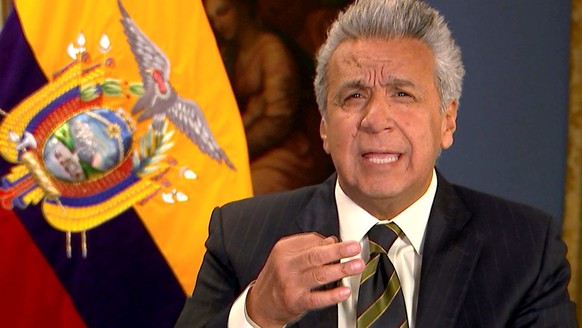 epa07498709 A grab from a handout video made available by the Ecuadoran Presidential Official Broadcast on 11 April 2019 shows Ecuadoran President Lenin Moreno Garces explaining his decision of withdr ...