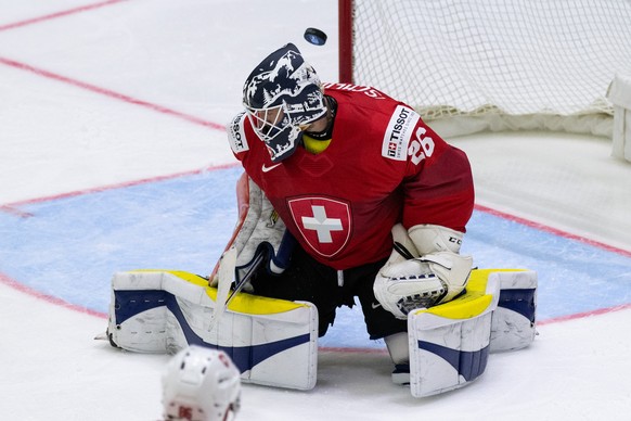 Switzerland&#039;s goaltender Sandro Aeschlimann is beat to 2-1 during the Ice Hockey World Championship group A preliminary round match between Switzerland and Kazachstan in Helsinki at the Ice Hocke ...