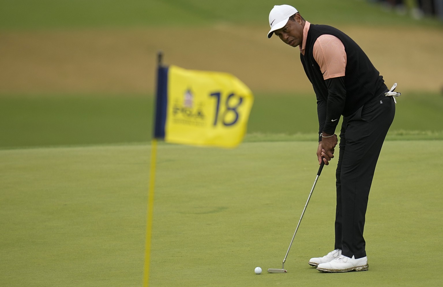 Tiger Woods putts on the 18th hole during the third round of the PGA Championship golf tournament at Southern Hills Country Club, Saturday, May 21, 2022, in Tulsa, Okla. (AP Photo/Sue Ogrocki)