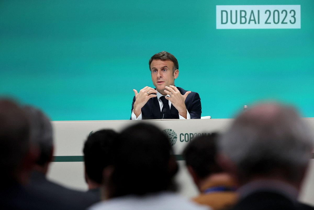 epa11007398 French President Emmanuel Macron speaks during a press conference as part of the third day of the 2023 United Nations Climate Change Conference (COP28) at Expo City Dubai in Dubai, UAE, 02 ...