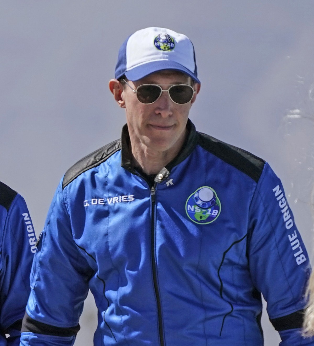 FILE - Glen de Vries, among four passengers on Blue Origin's New Shepard rocket, arrives for a media availability at the spaceport near Van Horn, Texas, Wednesday, Oct. 13, 2021. Glen de Vries, 4 ...