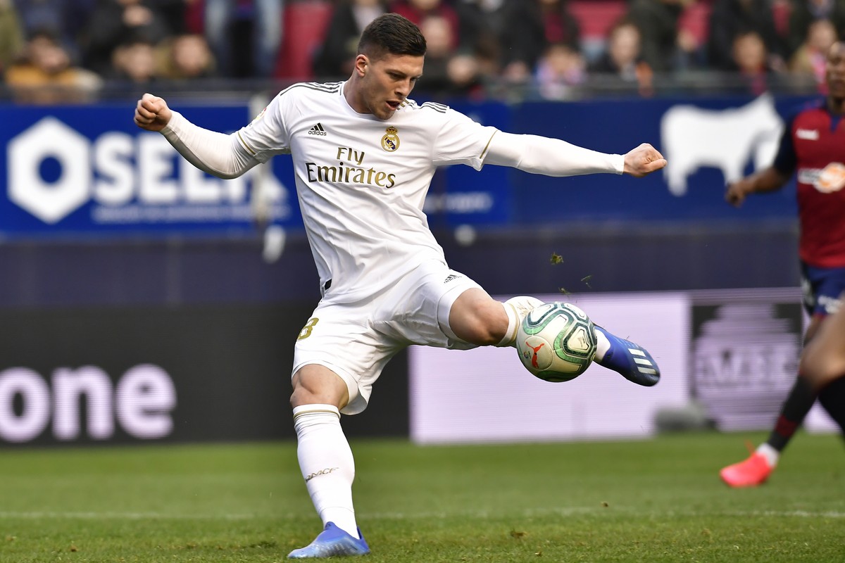 Real Madrid's Luka Jovic kicks the ball to score during the Spanish La Liga soccer match between Osasuna and Real Madrid at El Sadar stadium in Pamplona, northern Spain, Sunday, Feb. 9, 2020. (AP ...