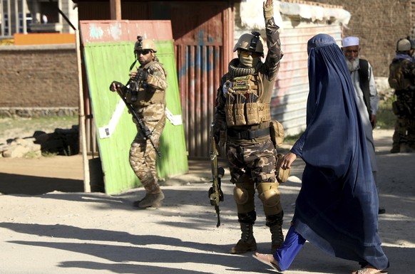 Afghan security personnel arrive at the site of a bomb explosion in Shakar Dara district of Kabul, Afghanistan, Friday, May 14, 2021. A bomb ripped through a mosque in northern Kabul during Friday pra ...