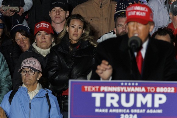 epa11277601 Women stand behind former US President Donald Trump while he speaks during a rally in Schnecksville, Pennsylvania, USA, 13 April 2024. Trump returned to the swing state of Pennsylvania day ...