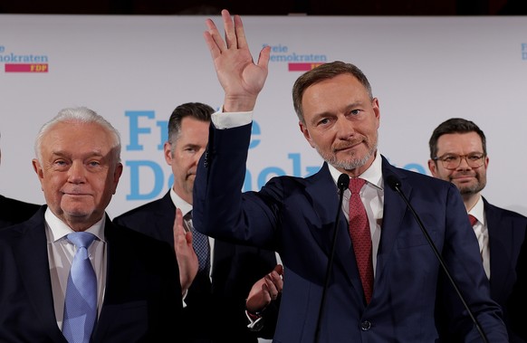 epa11919750 Chairman of the Free Democratic Party (FDP) and former German Finance Minister Christian Lindner (R) and Deputy Chairman of the FDP, Wolfgang Kubicki (L) attend the Free Democratic Party ( ...