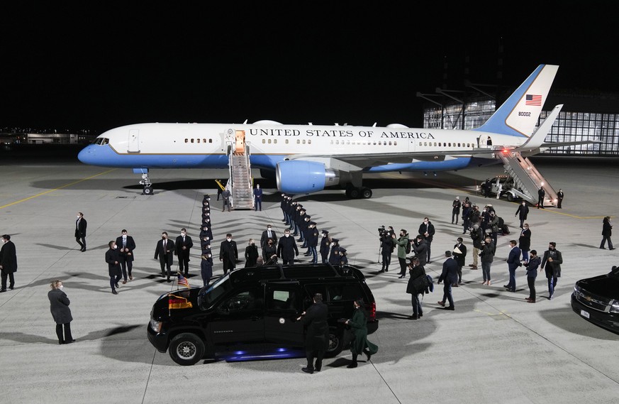 United States Vice President Kamala Harris, center, goes to her car after she arrives for the Munich Security Conference at the airport in Munich, Germany, Thursday, Feb. 17, 2022. (AP Photo/Michael P ...