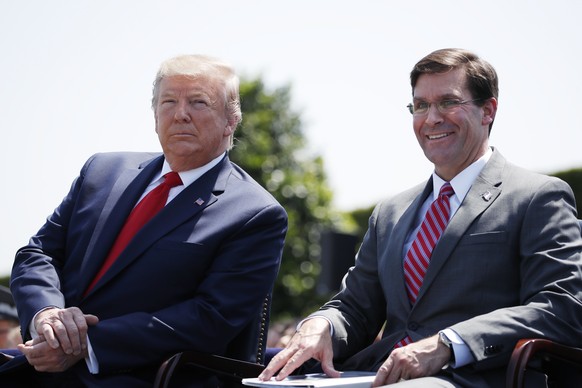 President Donald Trump, left, sits with Secretary of Defense Mark Esper, during a full honors welcoming ceremony for Esper at the Pentagon, Thursday, July 25, 2019, in Washington. (AP Photo/Alex Brand ...