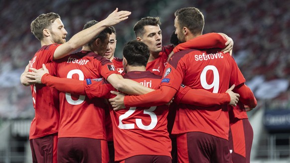 Swiss players celebrate after Xherdan Shaqiri, center no 23, scored to 1:0 during the FIFA World Cup Qatar 2022 qualifying Group C soccer match between Switzerland and Lithuania, at the Kybunpark Stad ...