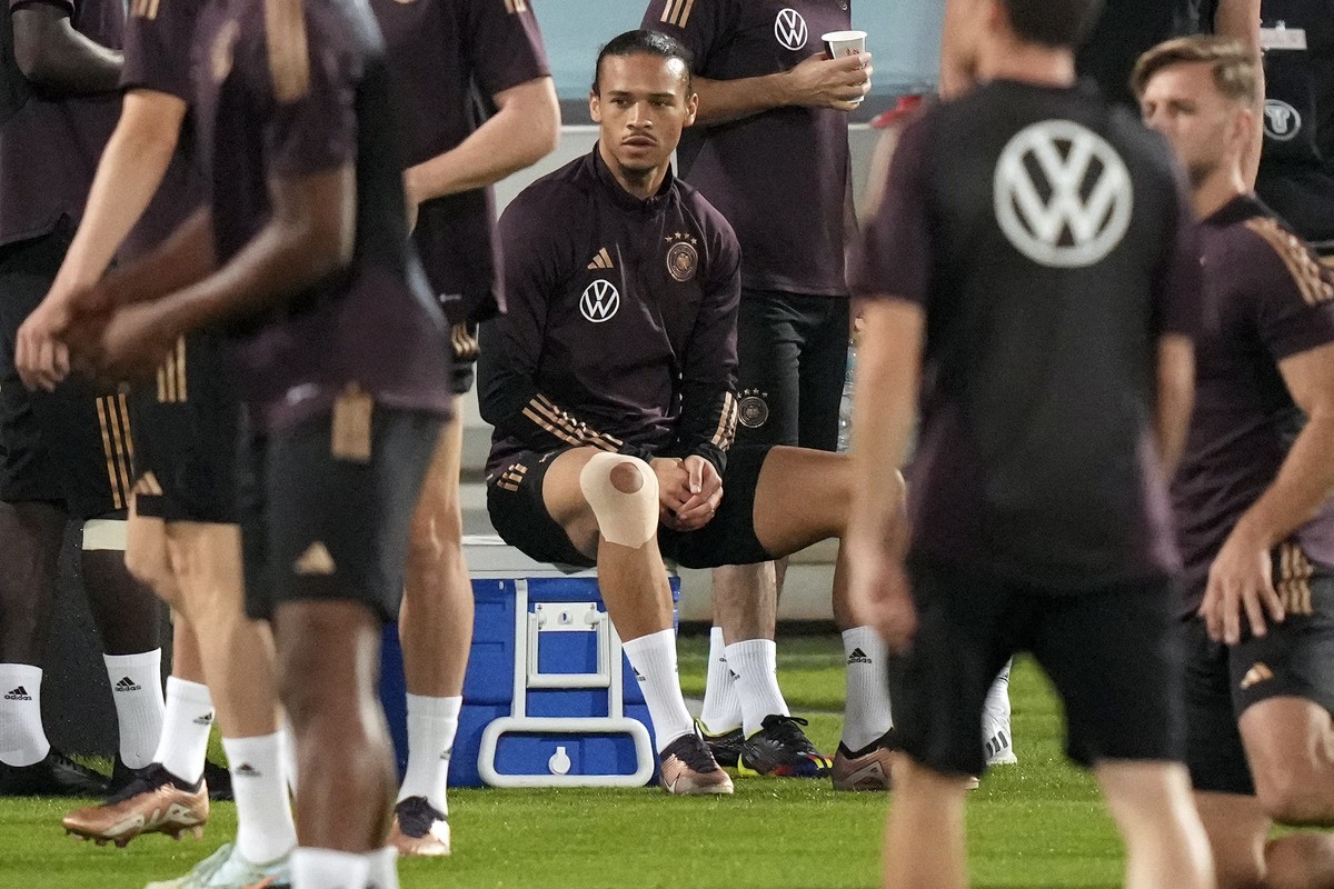 Germany's Leroy Sane waits for the start of a training session at the Al-Shamal stadium on the eve of the group E World Cup soccer match between Germany and Spain, in Al-Ruwais, Qatar, Friday, No ...