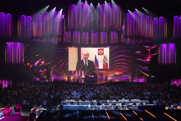 Russian President Vladimir Putin addresses participants and spectators of the International Music Competition &quot;Intervision&quot; via video link at the Live Arena outside Moscow, Russia, Saturday, ...