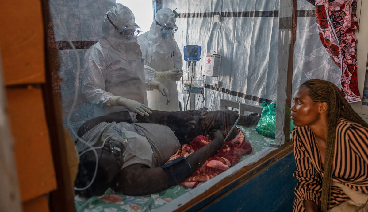 Health workers tend to an Ebola patient at the Rwampara Treatment Center in Ituri, Congo, Thursday, June 18, 2026. (AP Photo/Moses Sawasawa)
APTOPIX Congo Ebola