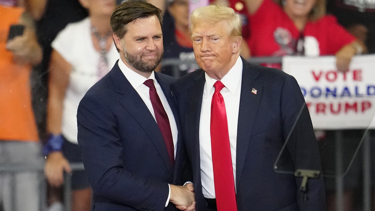 FILE - Republican vice presidential candidate Sen. JD Vance, R-Ohio, left, and Republican presidential candidate former President Donald Trump, shake hands at a campaign rally in Atlanta, Aug. 3, 2024 ...